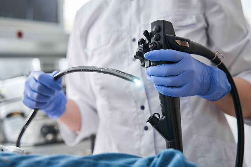 Doctor holding endoscopy equipment