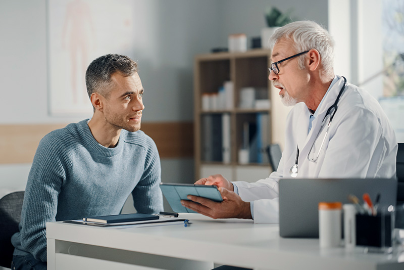 Doctor having a conversation with male patient
