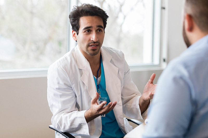 Doctor interviewing a potential candidate for hire