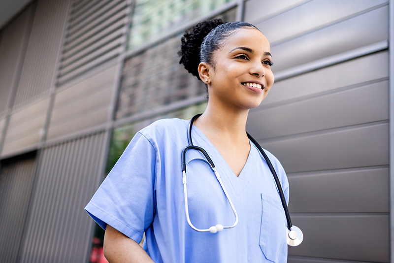 Proud-looking nurse outside a hospital